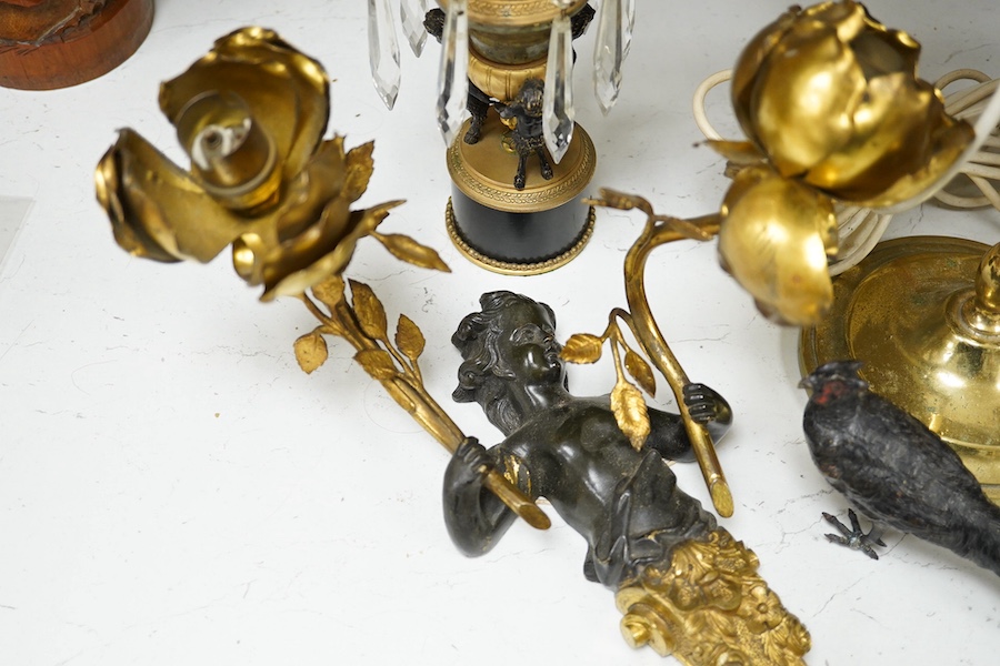 A bronze, ormolu and lustre candlestick, a bronze and ormolu cherub two branch sconce, a French brass student's lamp with black tole shade and a cold painted model of a peasant, student lamp 57cm high. Condition - fair t